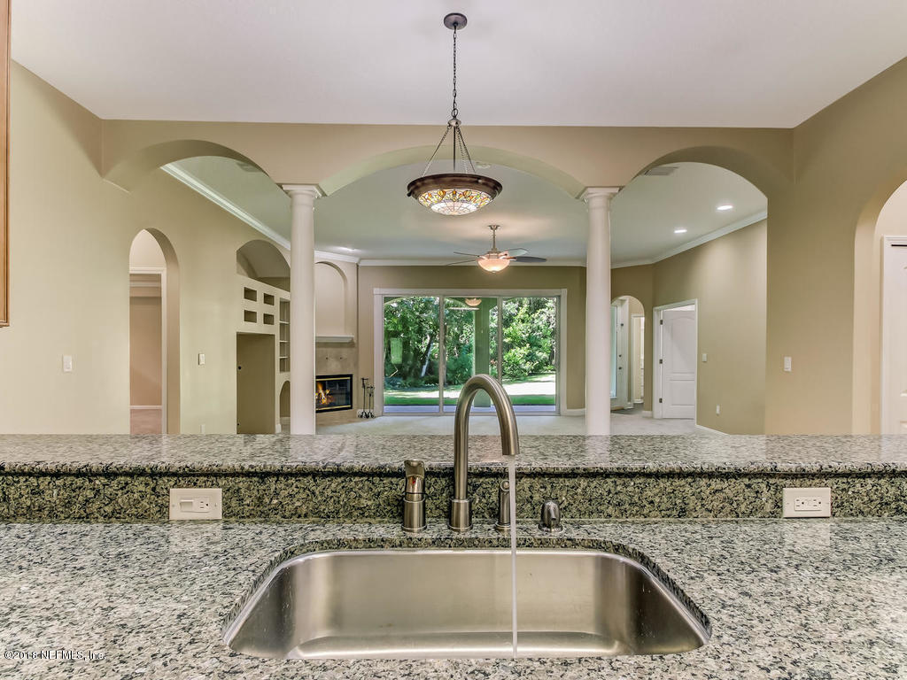 1576 Scott Road Fruit Cove, FL 32259 - Photo 26 of 87 a kitchen with a sink and a large mirror