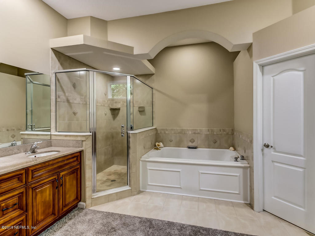 1576 Scott Road Fruit Cove, FL 32259 - Photo 32 of 87 a bathroom with a sink a toilet and shower