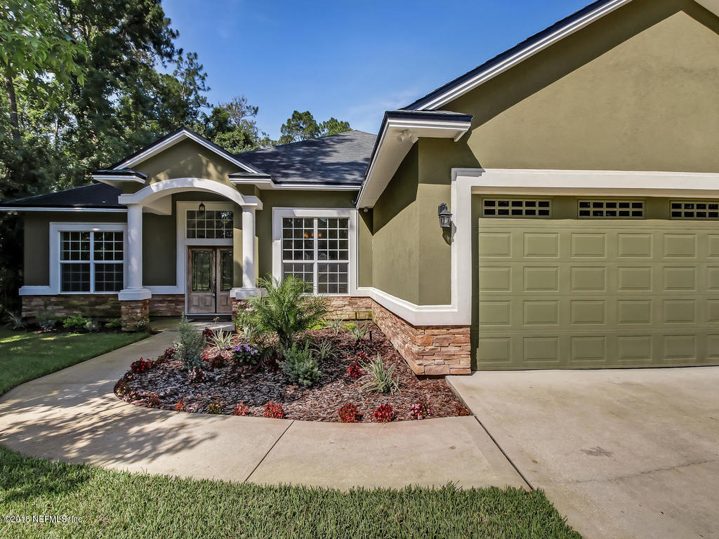 1576 Scott Road Fruit Cove, FL 32259 - Photo 4 of 87 a front view of a house with garden