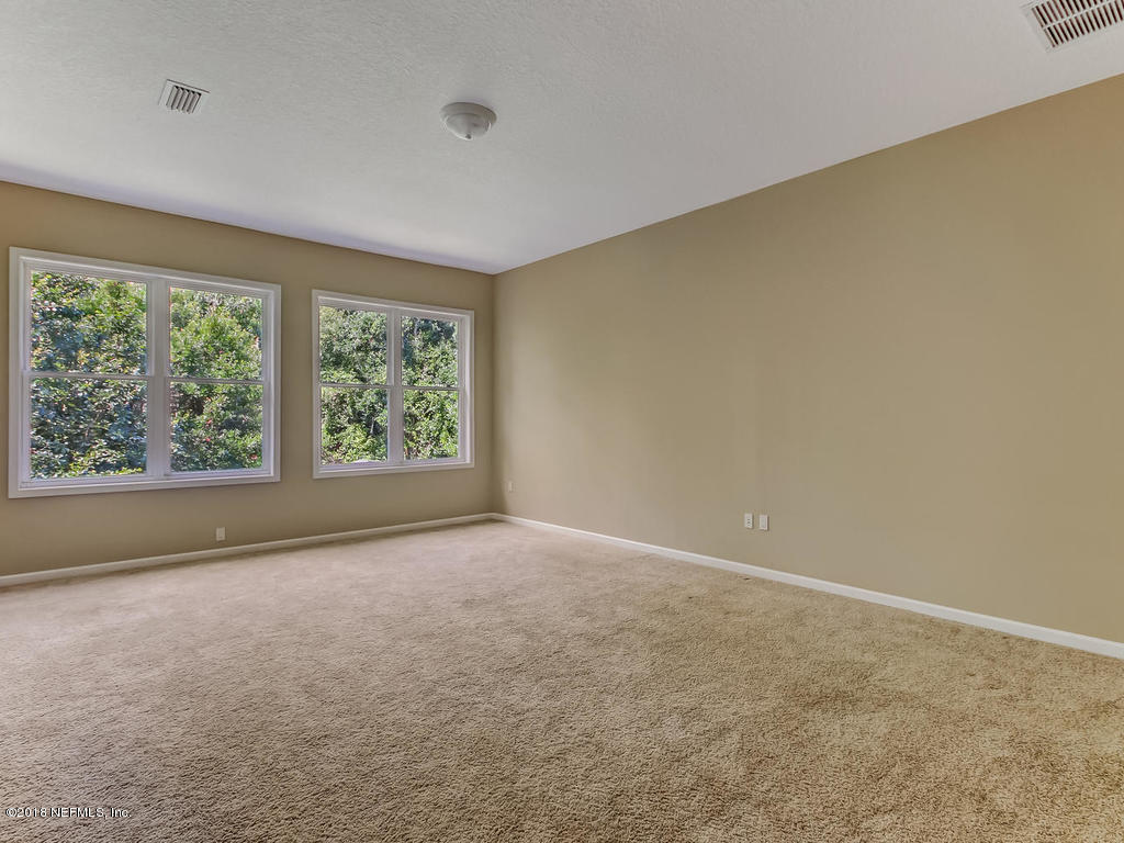 1576 Scott Road Fruit Cove, FL 32259 - Photo 49 of 87 an empty room with large windows