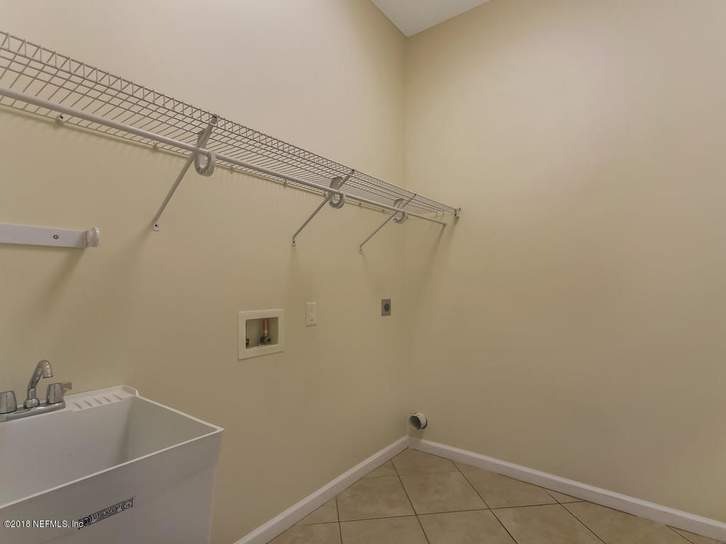 1576 Scott Road Fruit Cove, FL 32259 - Photo 54 of 87 a bathroom with a sink and shower