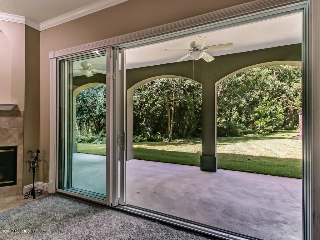 1576 Scott Road Fruit Cove, FL 32259 - Photo 55 of 87 a view of a porch with furniture and garden