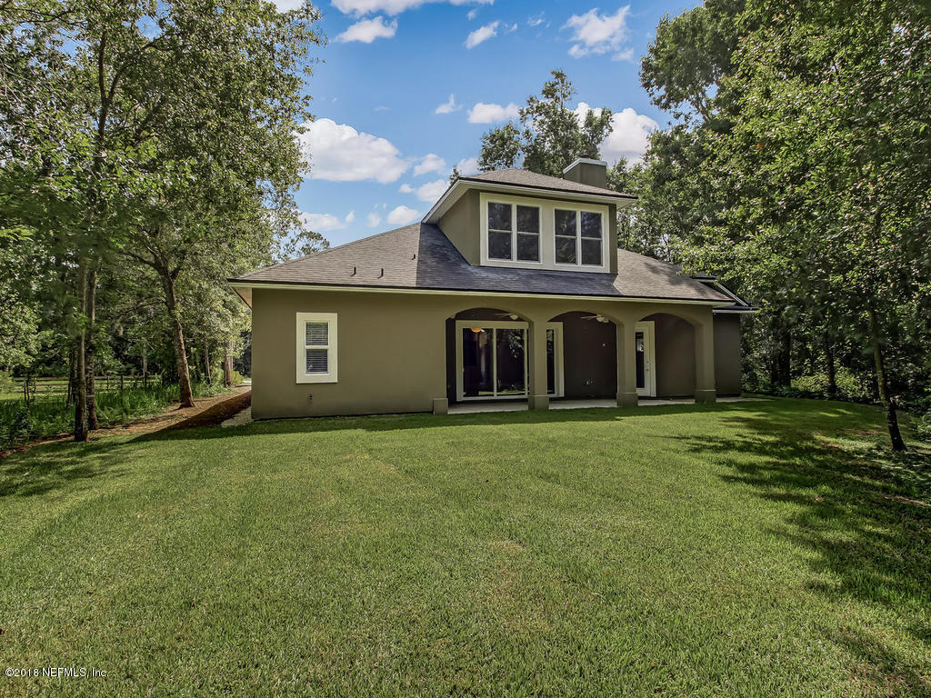 1576 Scott Road Fruit Cove, FL 32259 - Photo 61 of 87 front view of a house with a garden