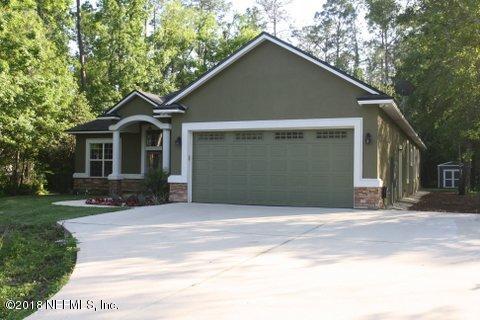 1576 Scott Road Fruit Cove, FL 32259 - Photo 67 of 87 a front view of a house with a yard and garage