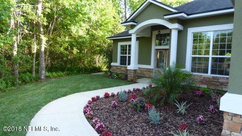 1576 Scott Road Fruit Cove, FL 32259 - Photo 68 of 87 a front view of a house with garden