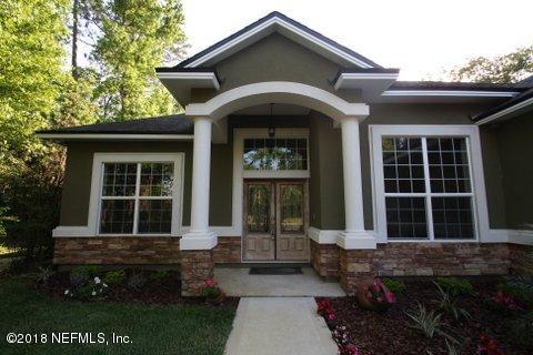 1576 Scott Road Fruit Cove, FL 32259 - Photo 69 of 87 a front view of a house with garden
