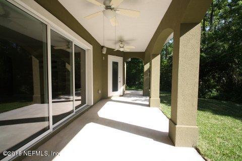 1576 Scott Road Fruit Cove, FL 32259 - Photo 75 of 87 a view of a porch with a floor to ceiling window and garden