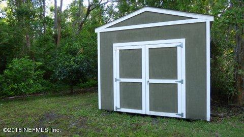1576 Scott Road Fruit Cove, FL 32259 - Photo 79 of 87 a front view of a house with a yard