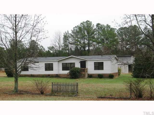 7516 Eagle Run Road Zebulon, NC 27597 - Photo 1 of 11 a view of a house with a yard