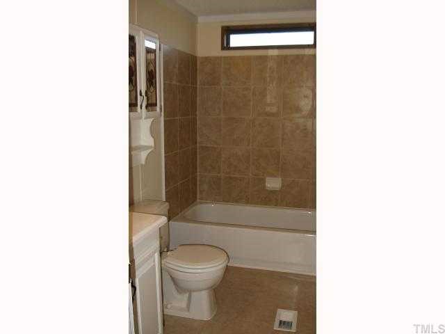7516 Eagle Run Road Zebulon, NC 27597 - Photo 11 of 11 a bathroom with a toilet and a shower