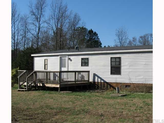 7516 Eagle Run Road Zebulon, NC 27597 - Photo 3 of 11 a view of a house with a yard