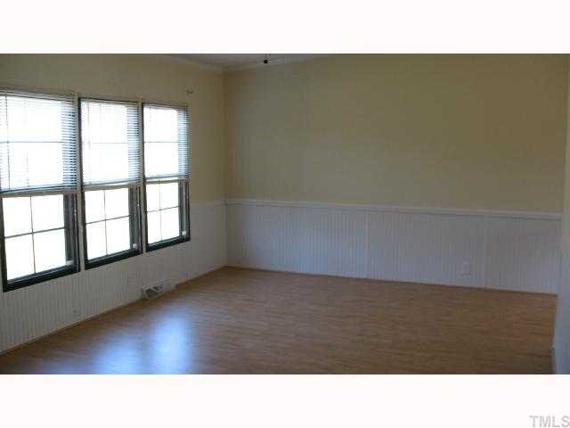 7516 Eagle Run Road Zebulon, NC 27597 - Photo 7 of 11 a open hall with a bench