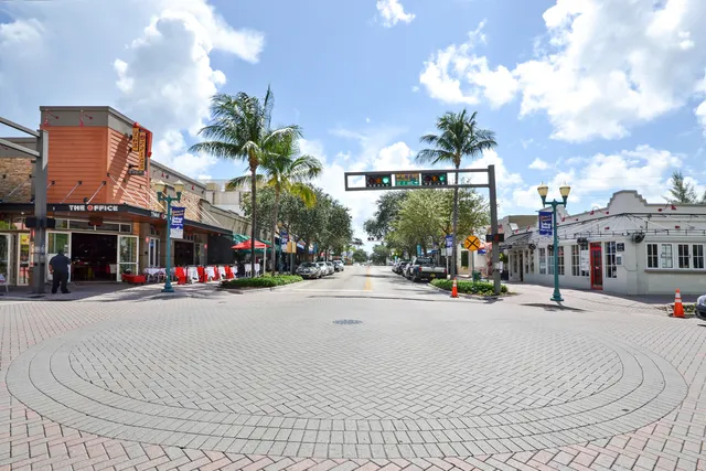 a view of a street with a building in the background