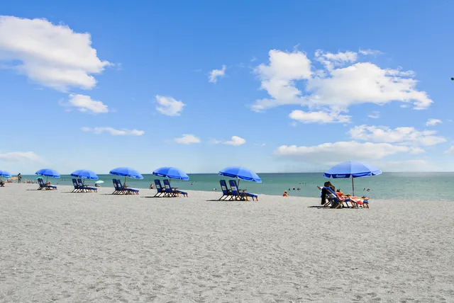 an outdoor space with furniture and umbrella