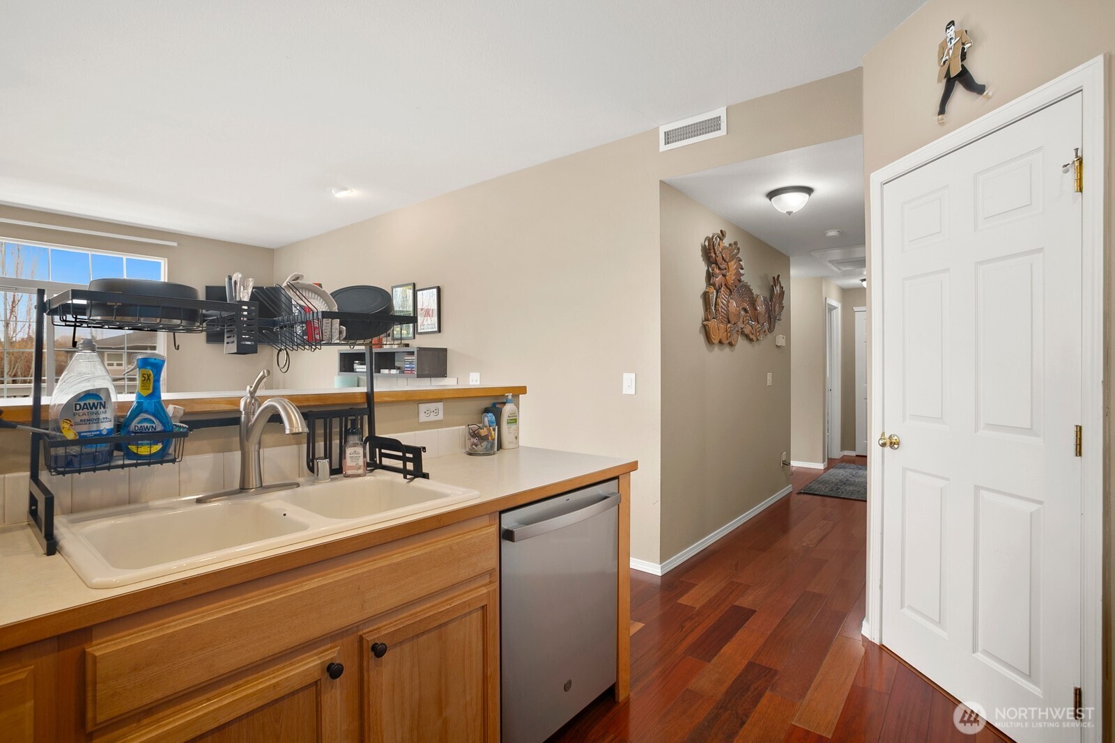 6830 20th Street East, Unit F5 Fife, WA 98424 - Photo 14 of 25 a room with stainless steel appliances lots of counter top space and wooden floor