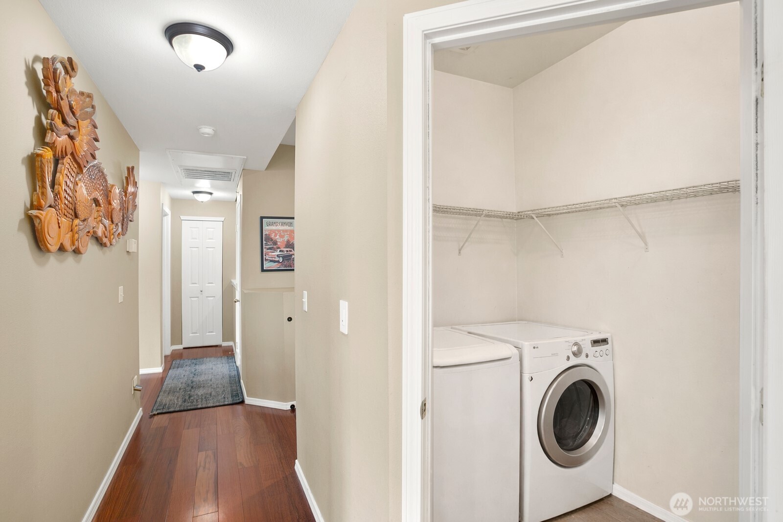 6830 20th Street East, Unit F5 Fife, WA 98424 - Photo 15 of 25 a view of a hallway with washer and dryer