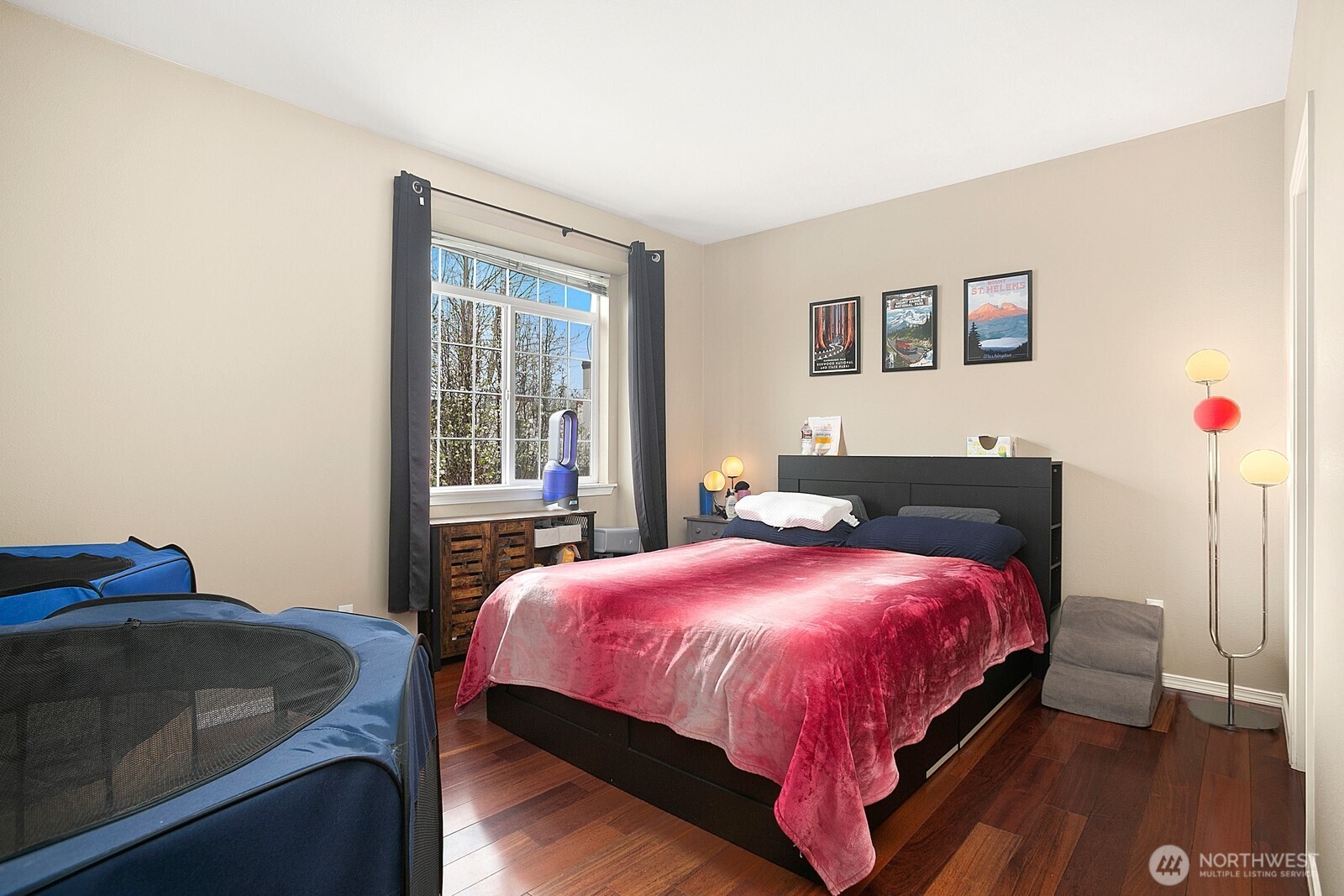 6830 20th Street East, Unit F5 Fife, WA 98424 - Photo 19 of 25 a bedroom with a bed and wooden floor