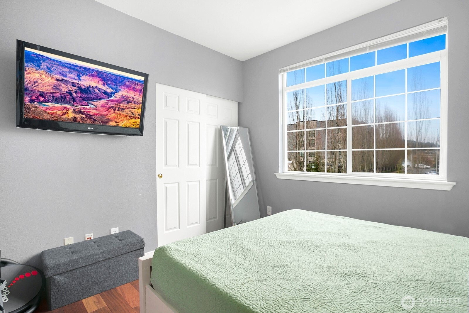 6830 20th Street East, Unit F5 Fife, WA 98424 - Photo 23 of 25 a bedroom with a bed and a window