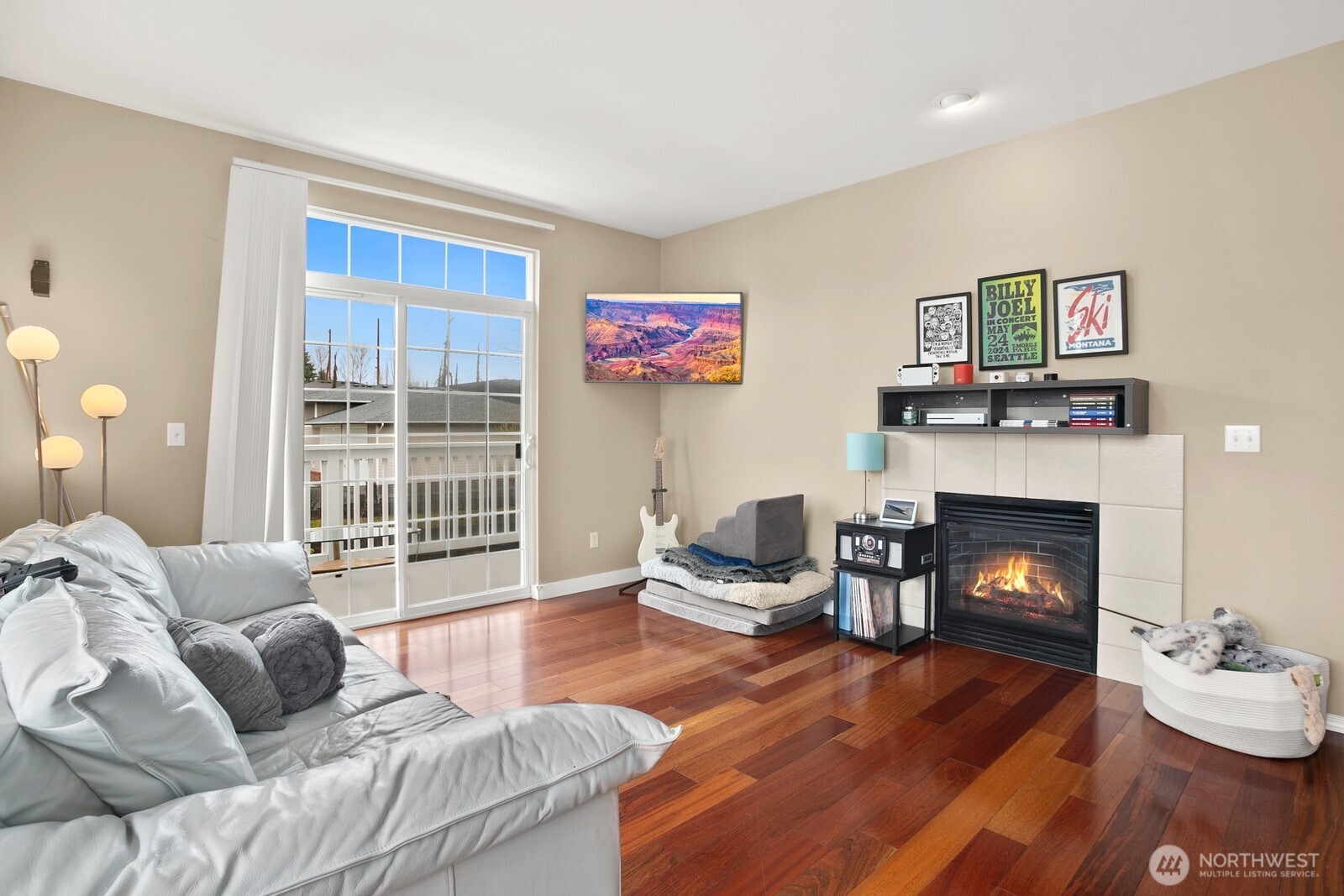 6830 20th Street East, Unit F5 Fife, WA 98424 - Photo 4 of 25 a living room with furniture and a fireplace