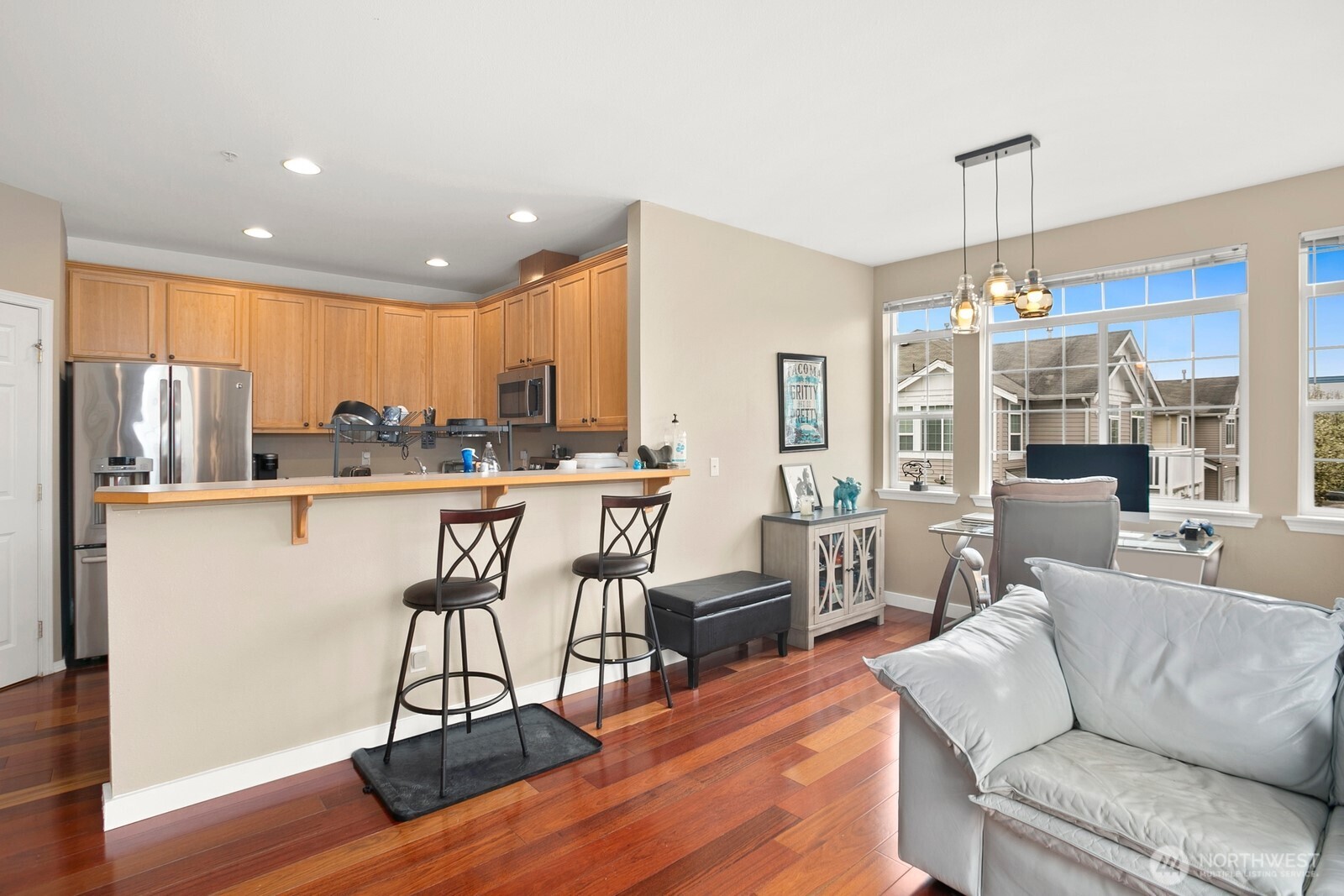 6830 20th Street East, Unit F5 Fife, WA 98424 - Photo 8 of 25 a living room with furniture a dining table and chairs