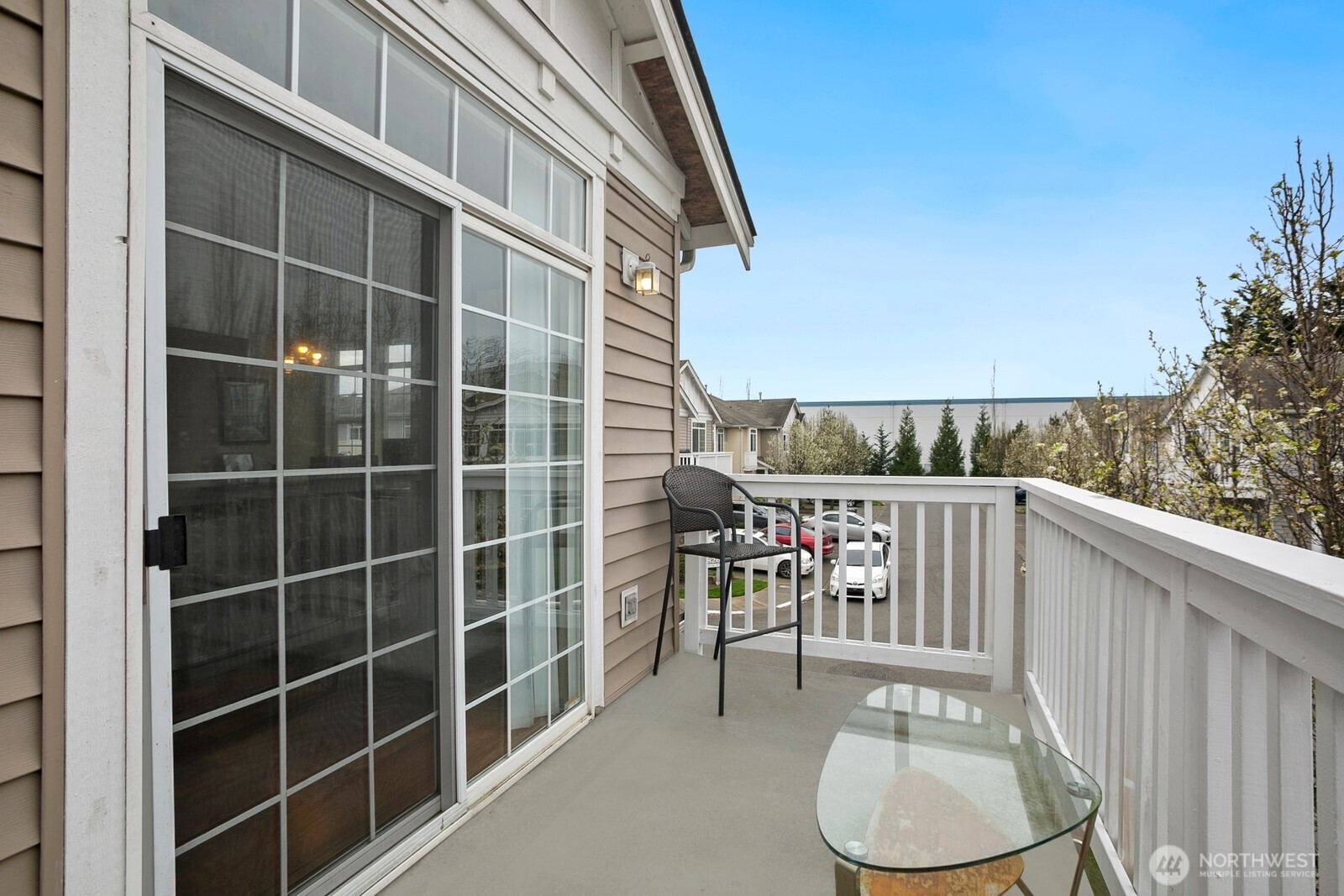 6830 20th Street East, Unit F5 Fife, WA 98424 - Photo 10 of 25 a balcony with table and chairs