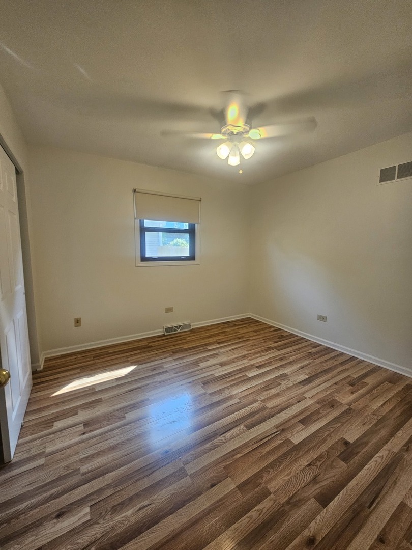 399 Purdue Lane Elgin, IL 60123 - Photo 12 of 24 a view of empty room with wooden floor