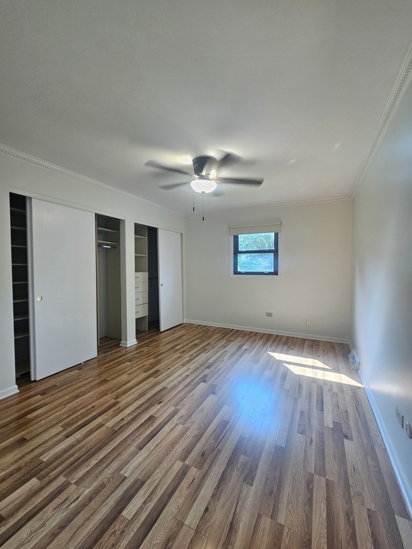 399 Purdue Lane Elgin, IL 60123 - Photo 14 of 24 a view of an empty room with wooden floor and a window