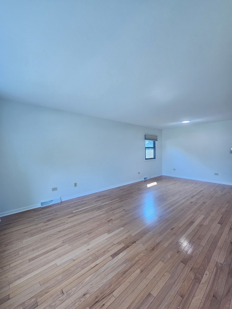 399 Purdue Lane Elgin, IL 60123 - Photo 2 of 24 a view of empty room with wooden floor