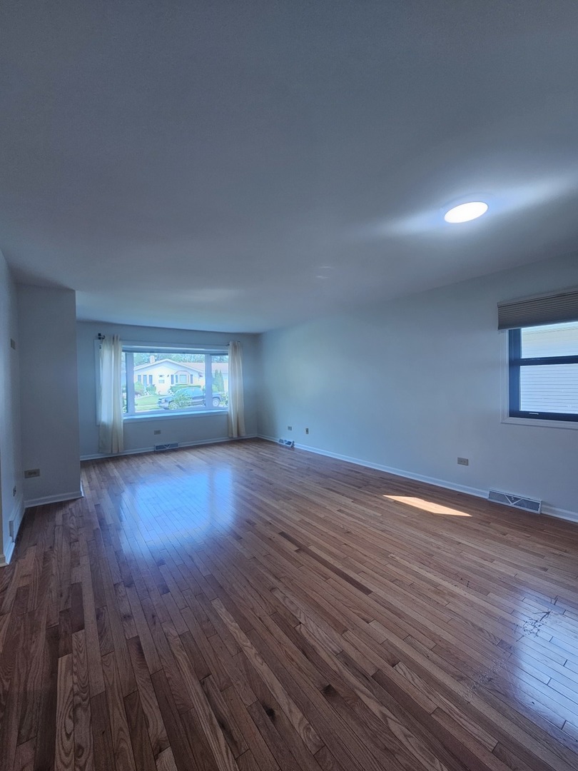 399 Purdue Lane Elgin, IL 60123 - Photo 3 of 24 a view of empty room with wooden floor