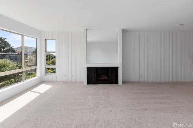 an empty room with fireplace
