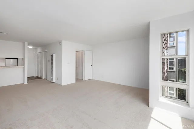 an empty room with a fireplace