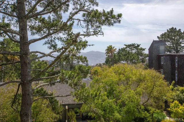 a view of a lake with a house in the background