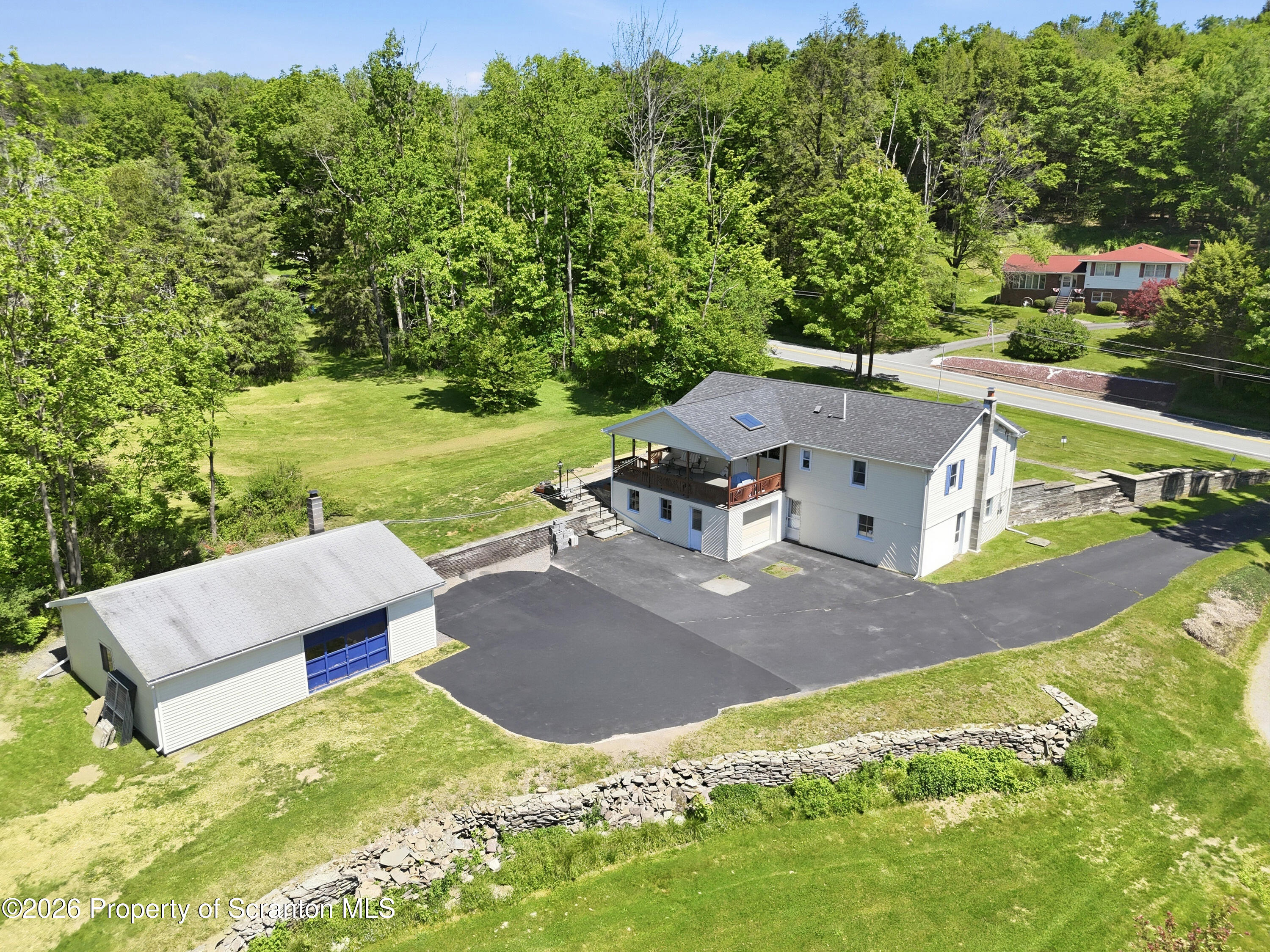 1237 Heart Lake Road Scott Township, PA 18433 - Photo 34 of 39 an aerial view of a house with garden space and a patio