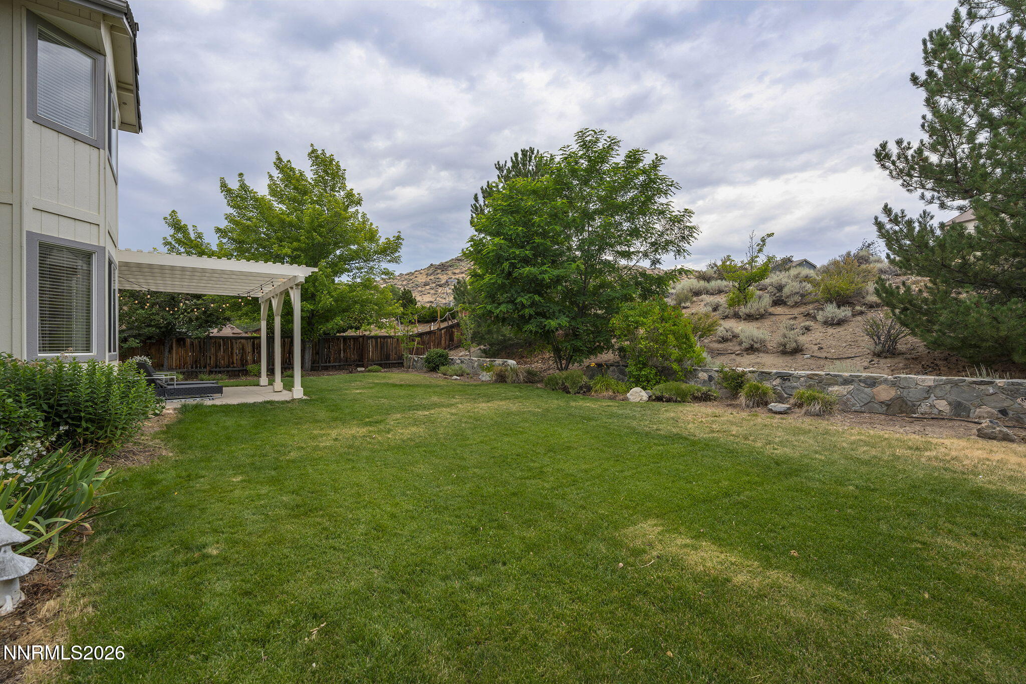 3736 Vancouver Drive Reno, NV 89511 - Photo 35 of 42 Spacious Backyard with Pergola