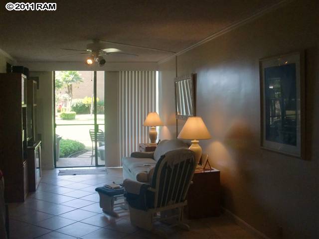 938 South Kihei Road, Unit 122 Kihei, HI 96753 - Photo 2 of 7 a room with furniture and a large window