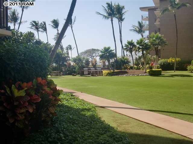 938 South Kihei Road, Unit 122 Kihei, HI 96753 - Photo 3 of 7 a view of a golf course with a garden