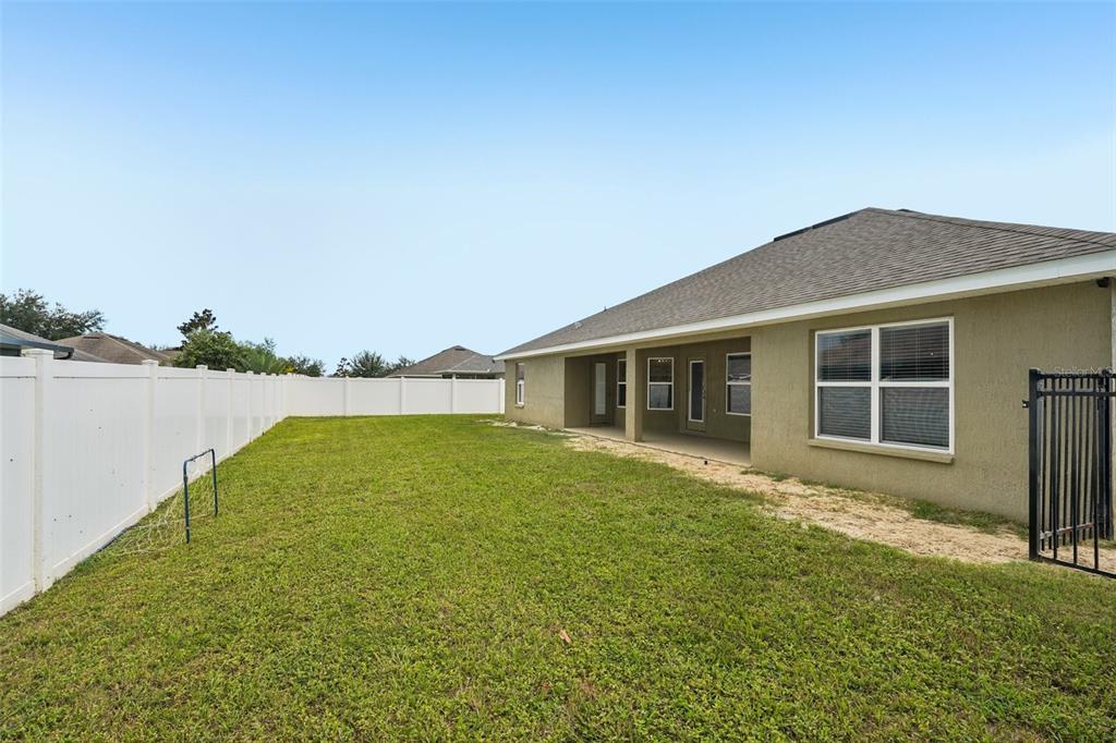 9846 Southwest 55th Ave Road Ocala, FL 34476 - Photo 24 of 25 a view of a house with backyard and garden