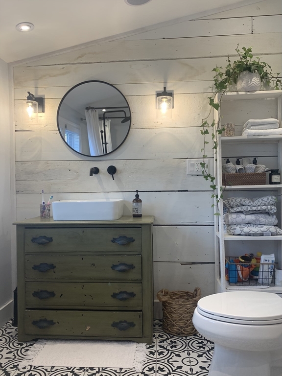 2208 Washington Street Canton, MA 02021 - Photo 11 of 15 a bathroom with a toilet a sink and mirror