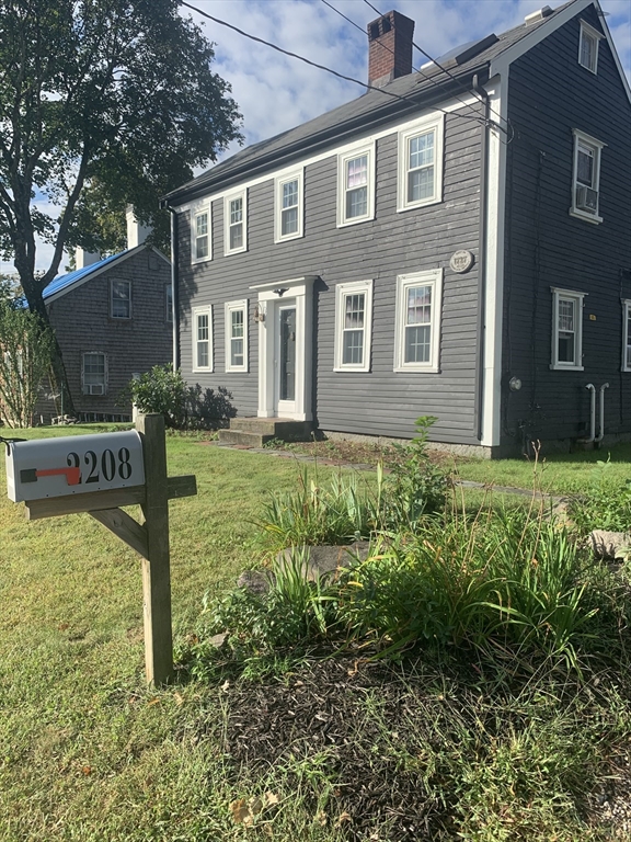 2208 Washington Street Canton, MA 02021 - Photo 15 of 15 a front view of a house with garden