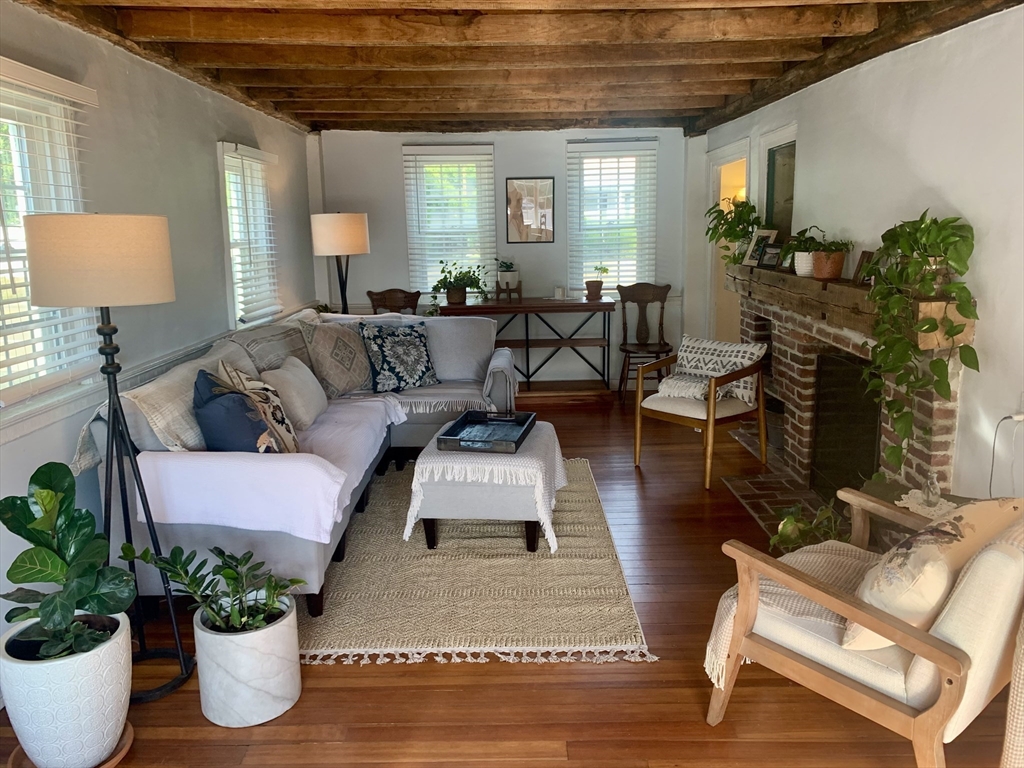 2208 Washington Street Canton, MA 02021 - Photo 2 of 15 a living room with furniture and a potted plant
