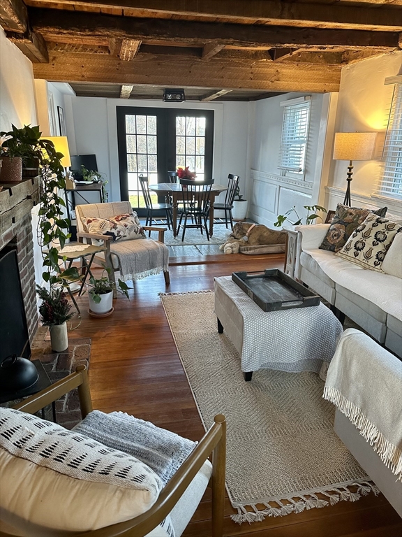 2208 Washington Street Canton, MA 02021 - Photo 3 of 15 a living room with lots of furniture and a chandelier