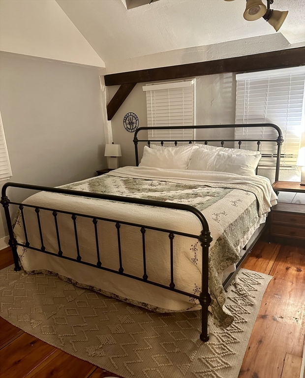 2208 Washington Street Canton, MA 02021 - Photo 7 of 15 a bedroom with a bed and wooden floor
