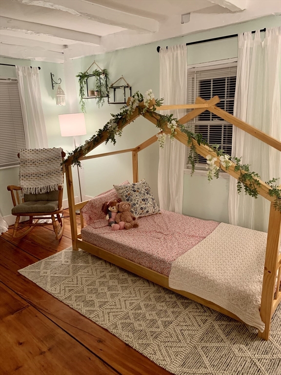 2208 Washington Street Canton, MA 02021 - Photo 8 of 15 a bedroom with a bed and the view of living room