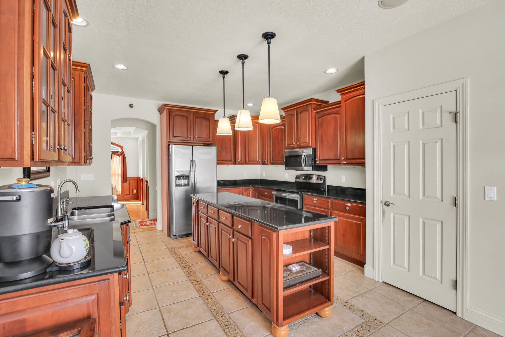 2202 Strand Drive Champaign, IL 61822 - Photo 17 of 62 a kitchen with stainless steel appliances granite countertop a stove and a refrigerator