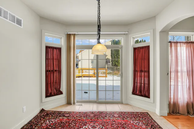 a view of water heater room with a ceiling fan