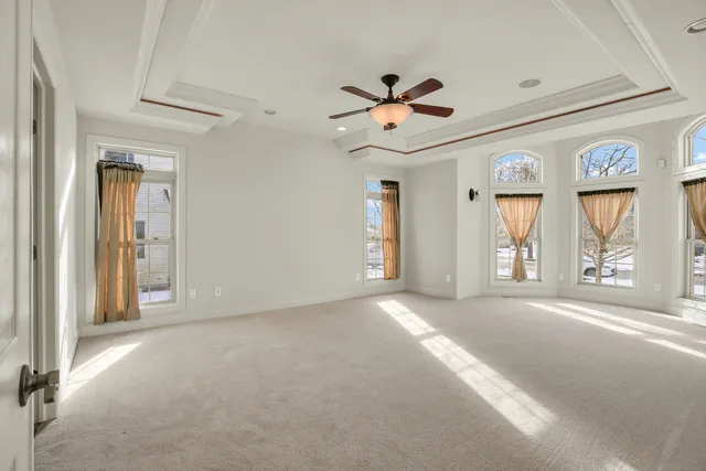 a bathroom with a granite countertop tub sink shower and mirror