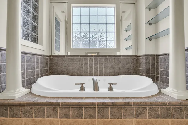 a living room with furniture and a ceiling fan