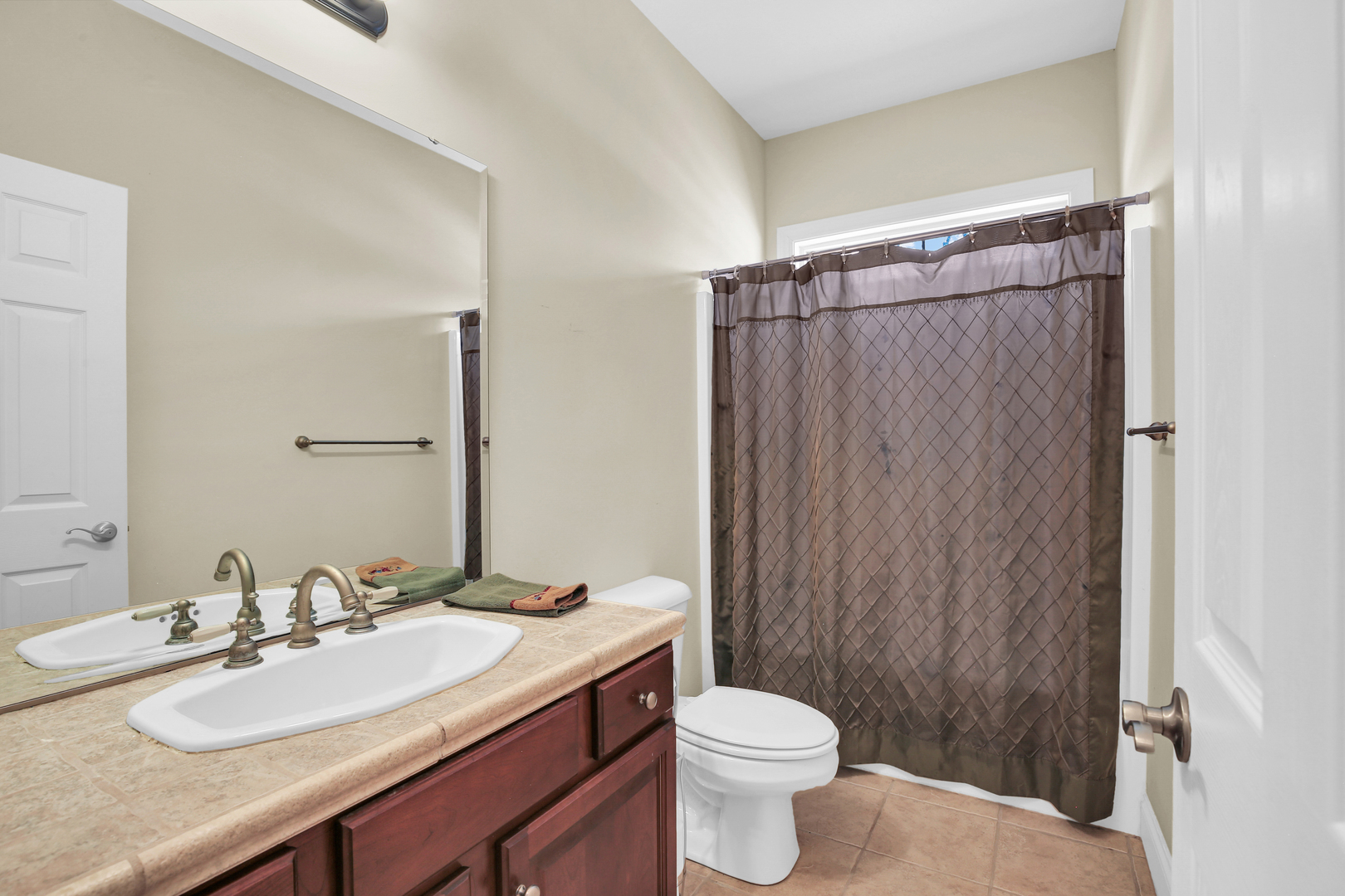 2202 Strand Drive Champaign, IL 61822 - Photo 31 of 62 a bathroom with a granite countertop sink toilet and shower