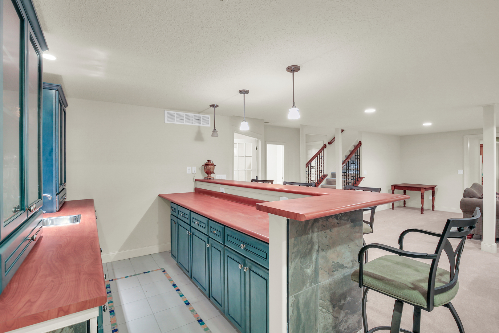 2202 Strand Drive Champaign, IL 61822 - Photo 37 of 62 a room with stainless steel appliances kitchen island a table and chairs in it