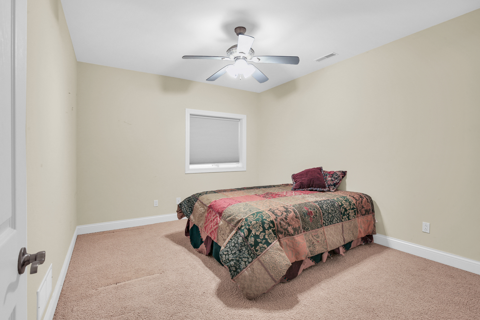 2202 Strand Drive Champaign, IL 61822 - Photo 42 of 62 a bedroom with a bed and a chandelier